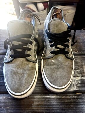 Vans gray suede sneakers with black & white checkerboard pattern on the side